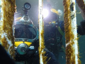 commercial divers underwater working